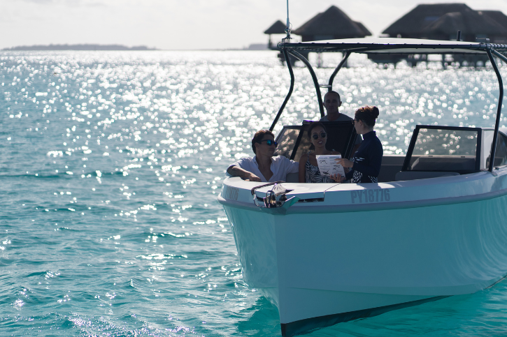 Marine educator on a boat in the ocean with guests